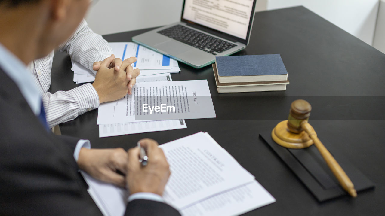 high angle view of business colleagues working on table