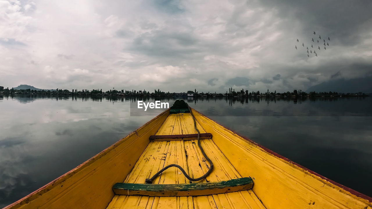 Pier over lake against sky