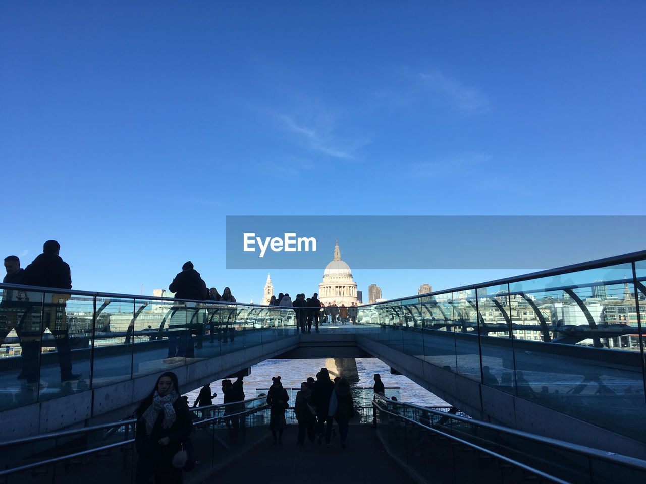 People on millennium footbridge in city