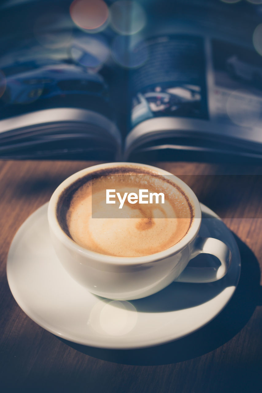 Close-up of coffee cup on table