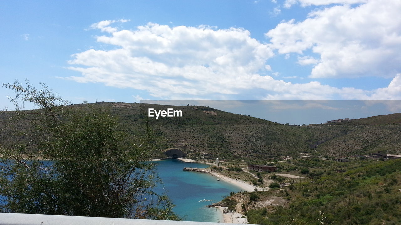 SCENIC VIEW OF RIVER AMIDST LANDSCAPE AGAINST SKY