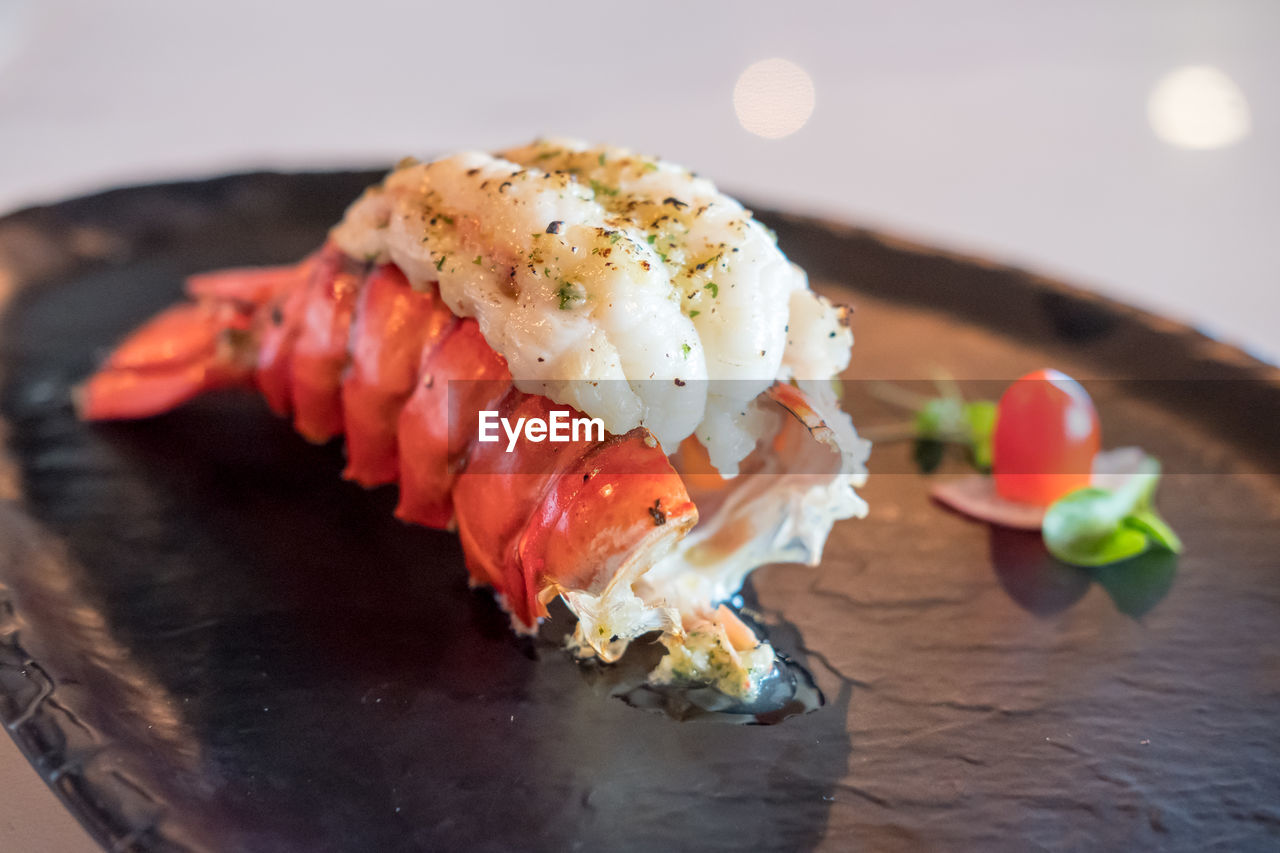 CLOSE-UP OF SUSHI SERVED IN PLATE