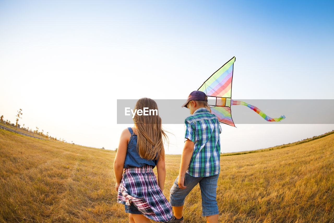 YOUNG COUPLE ON FIELD