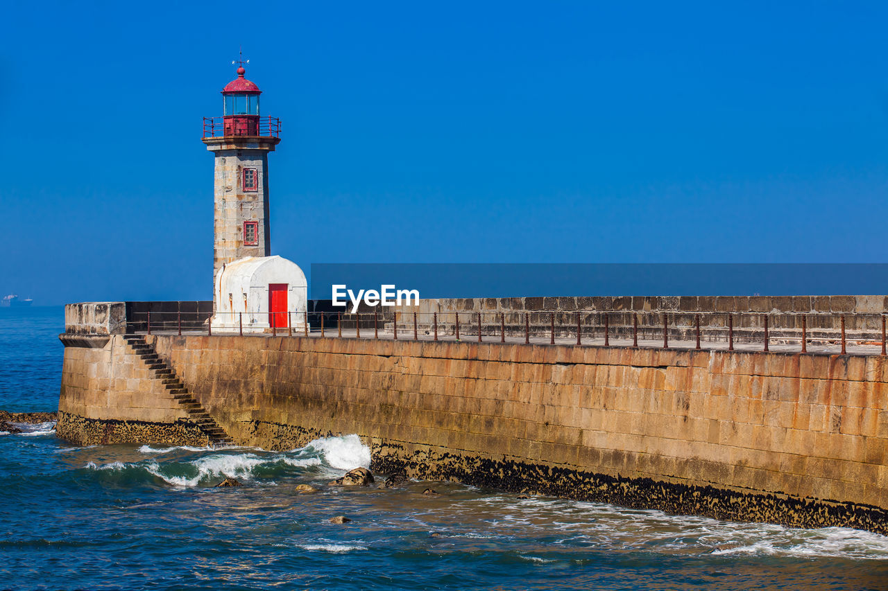 Historical felgueiras lighthouse built on 1886 and located at douro river mouth in porto city