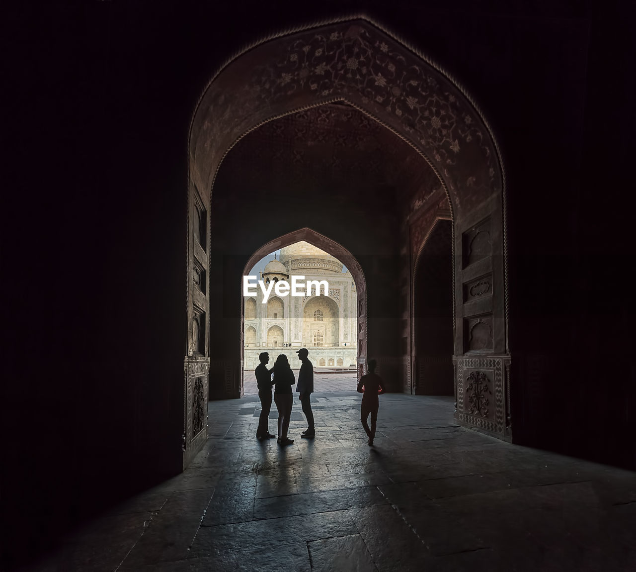 PEOPLE WALKING IN HISTORIC BUILDING