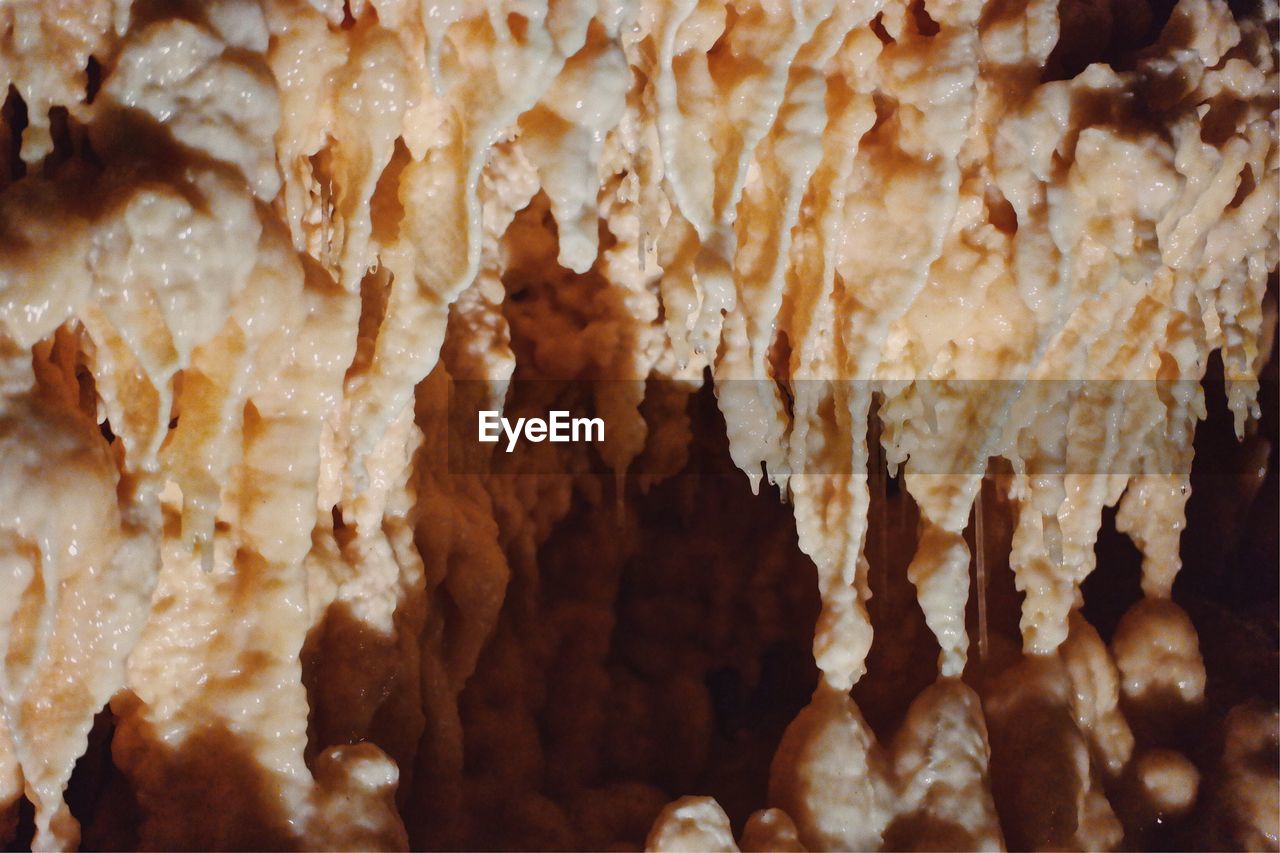 Close-up of stalactite hanging in cave