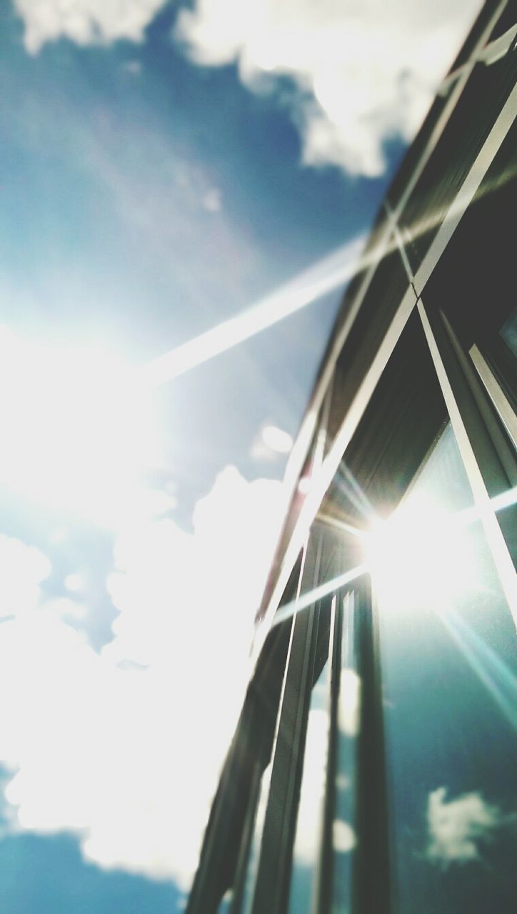 SUN SHINING THROUGH CLOUDS