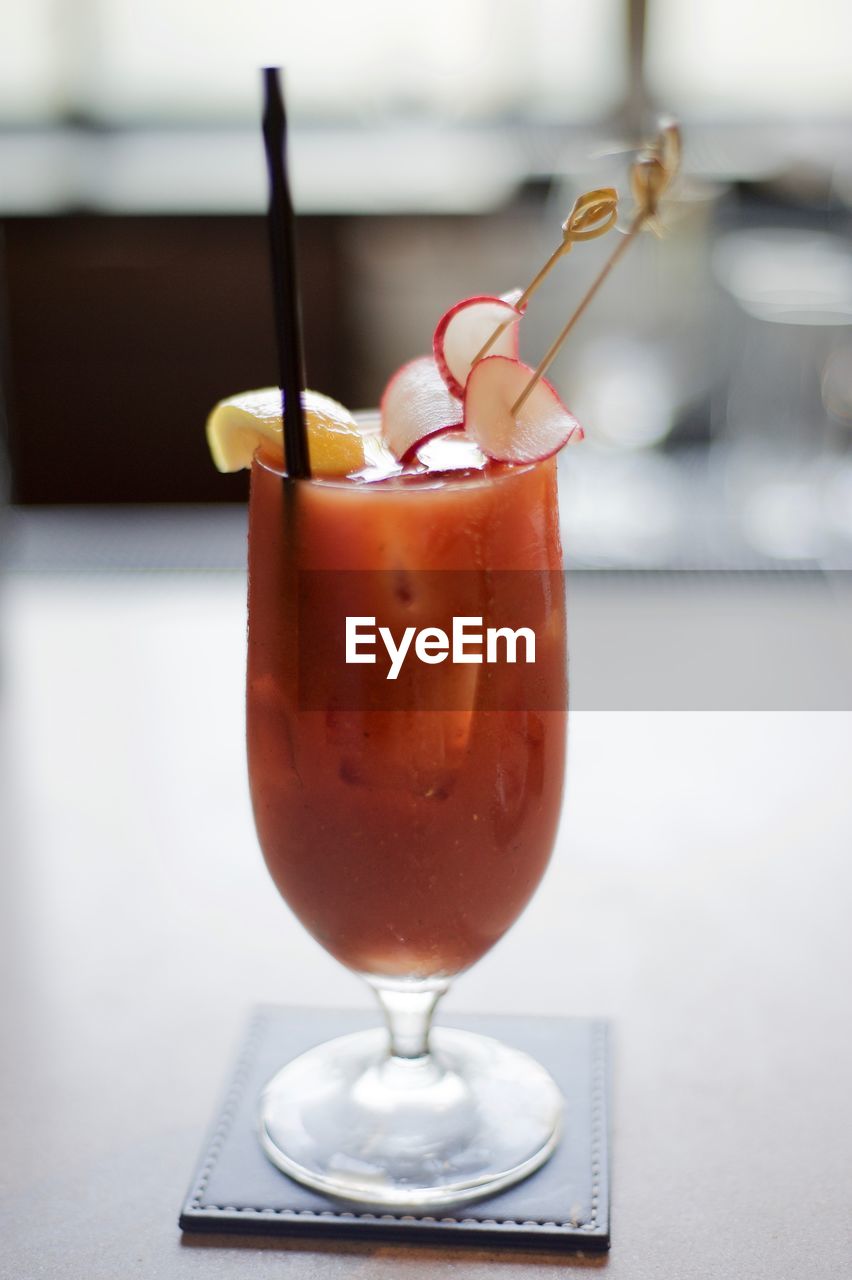 Close-up of fresh bloody mary served on table at restaurant