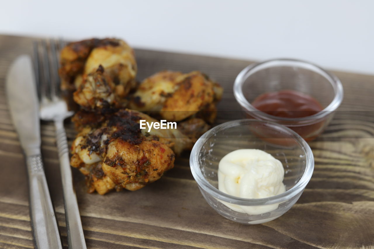 food and drink, food, dish, freshness, healthy eating, breakfast, dessert, produce, meal, wellbeing, indoors, baked, no people, fried food, studio shot, wood, eating utensil, close-up, vegetable, household equipment, table, kitchen utensil, meat, focus on foreground, fritter, bowl
