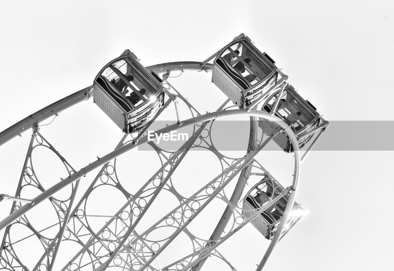 LOW ANGLE VIEW OF ROLLERCOASTER AGAINST SKY