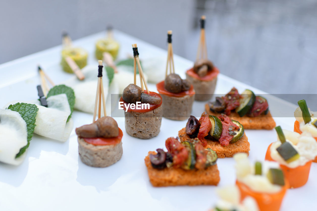 food and drink, food, appetizer, dish, healthy eating, pincho, canapé, meal, fruit, vegetable, cuisine, freshness, no people, wellbeing, plate, brunch, produce, breakfast, cheese, indoors, brochette, olive, snack, fast food, dairy