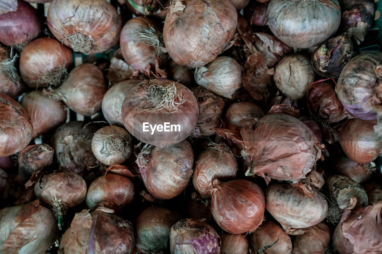 Full frame shot of onions for sale at market