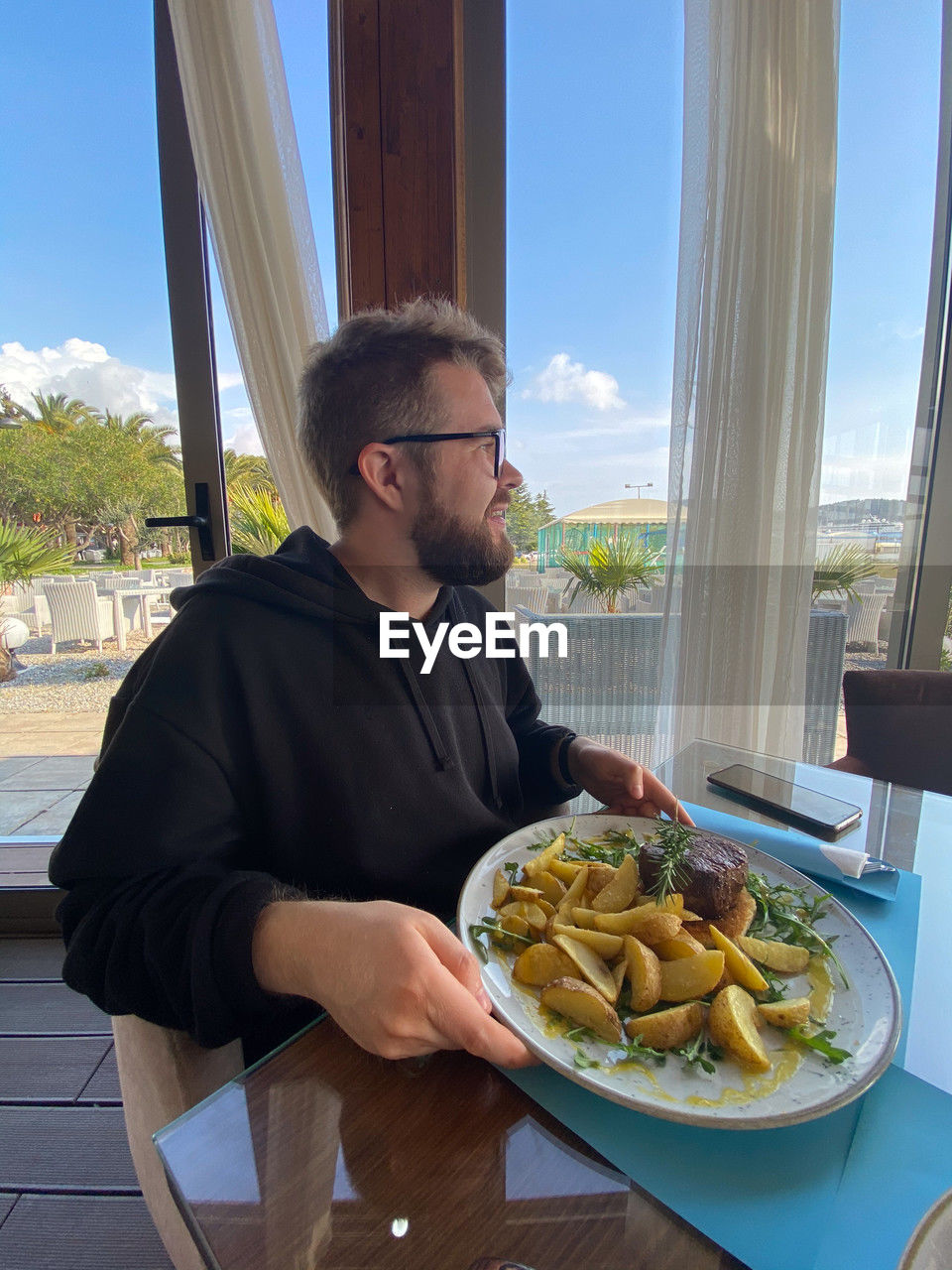 portrait of young man having food