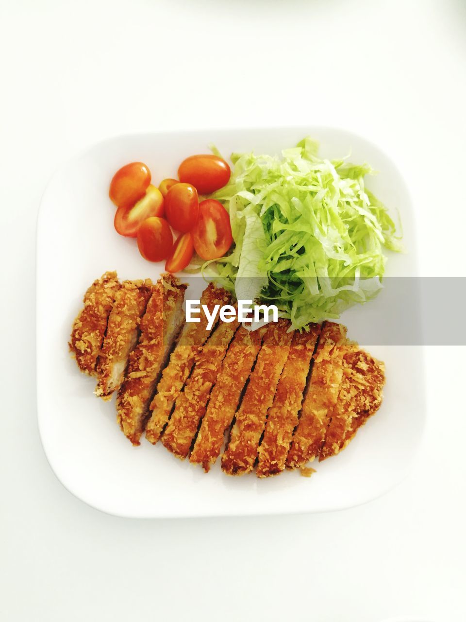 High angle view of meal served in plate over white background