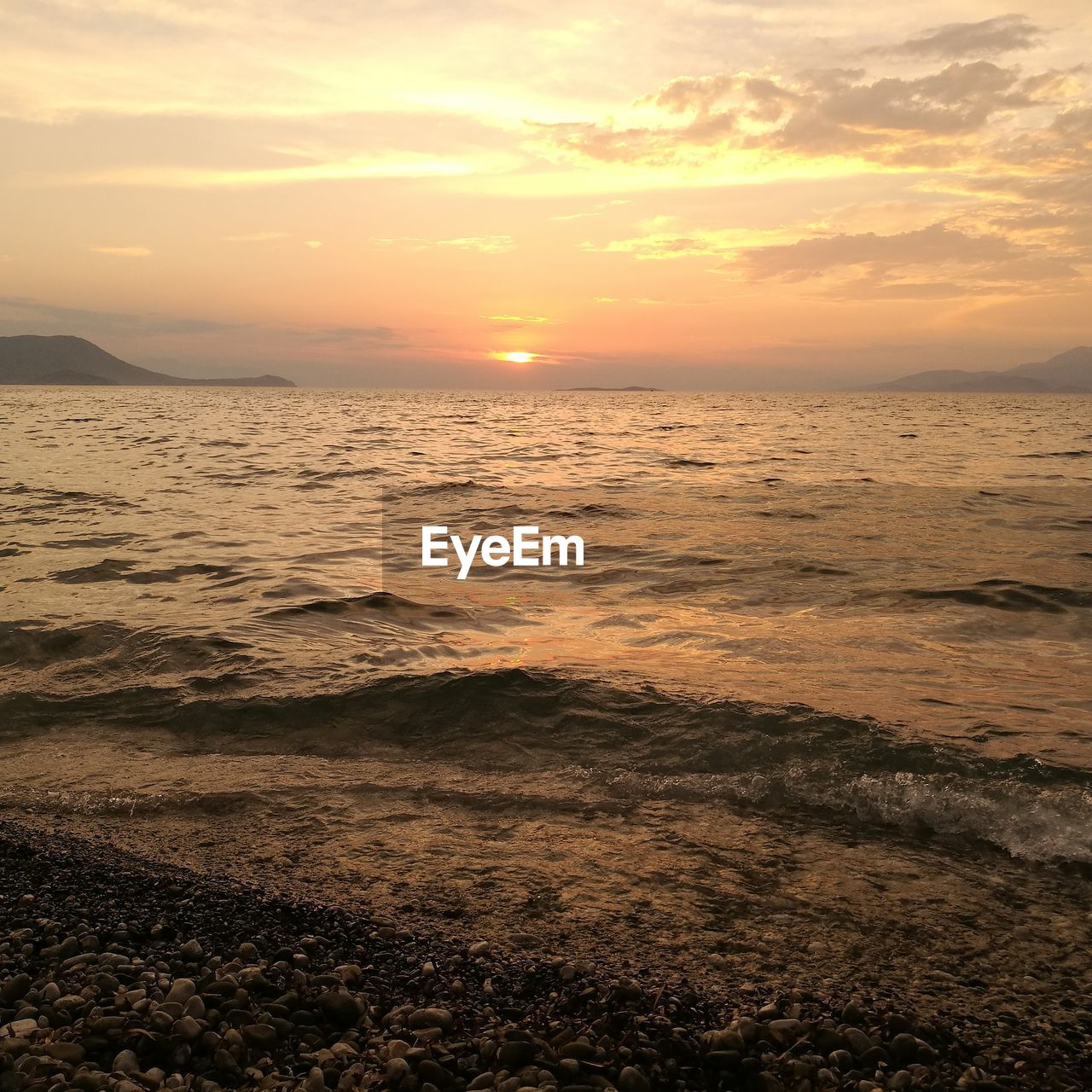 Scenic view of sea against dramatic sky