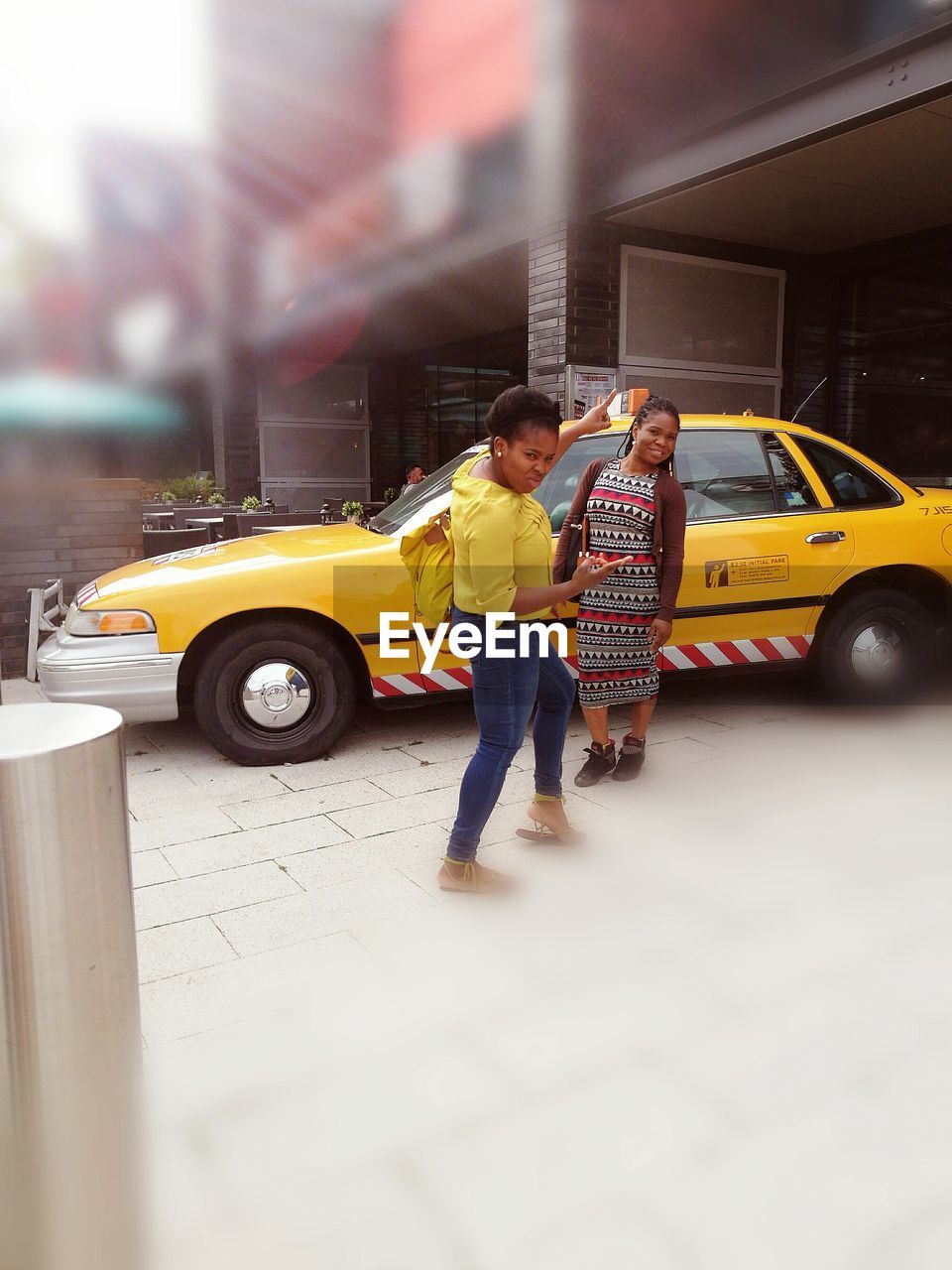 FULL LENGTH OF A YOUNG MAN WITH CAR