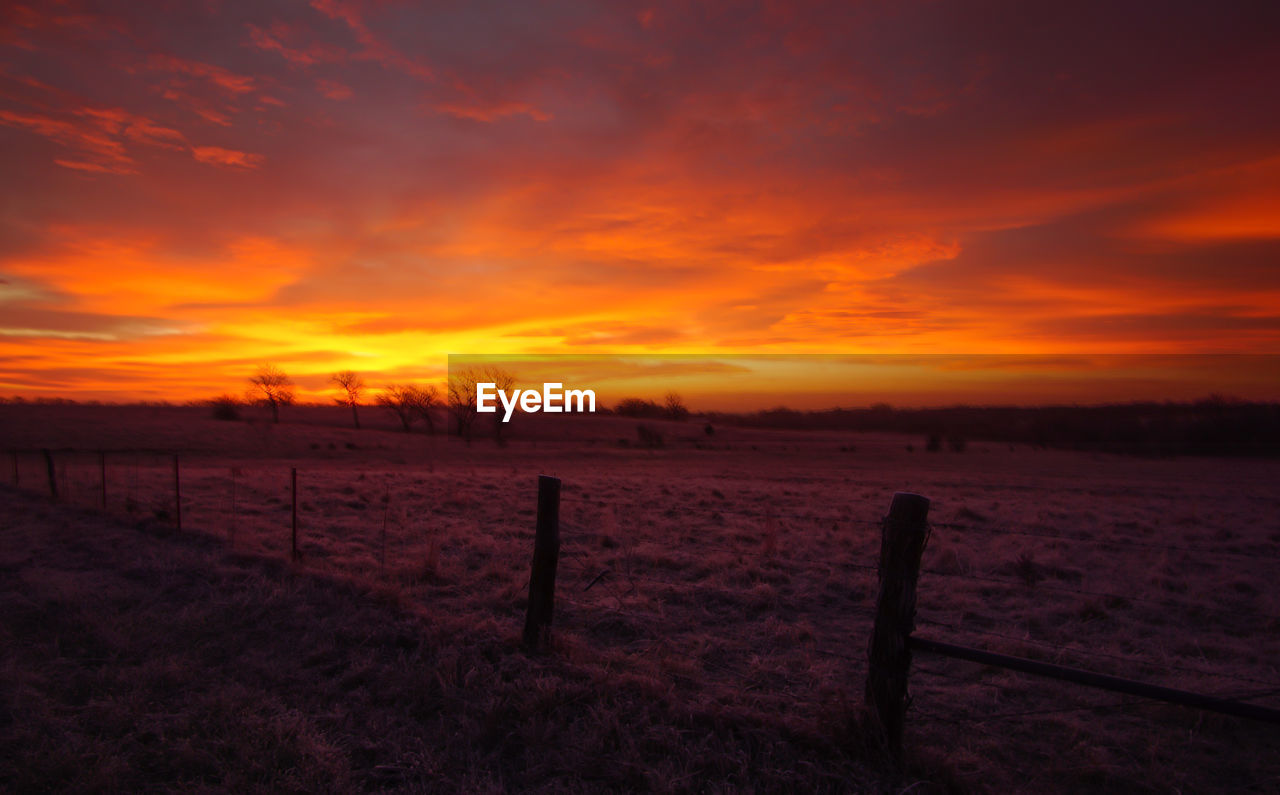 FIELD AGAINST SKY DURING SUNSET