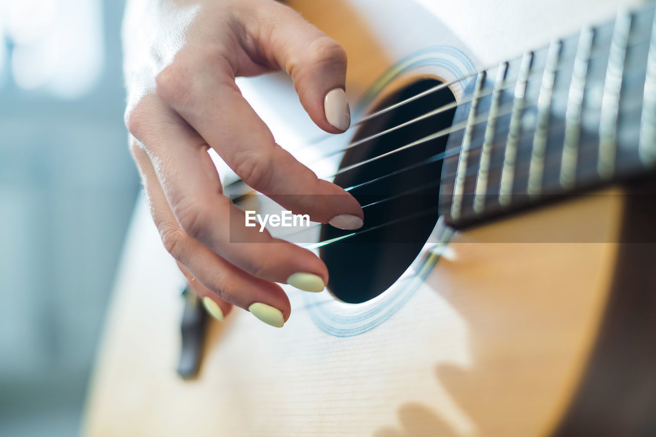 MAN PLAYING GUITAR