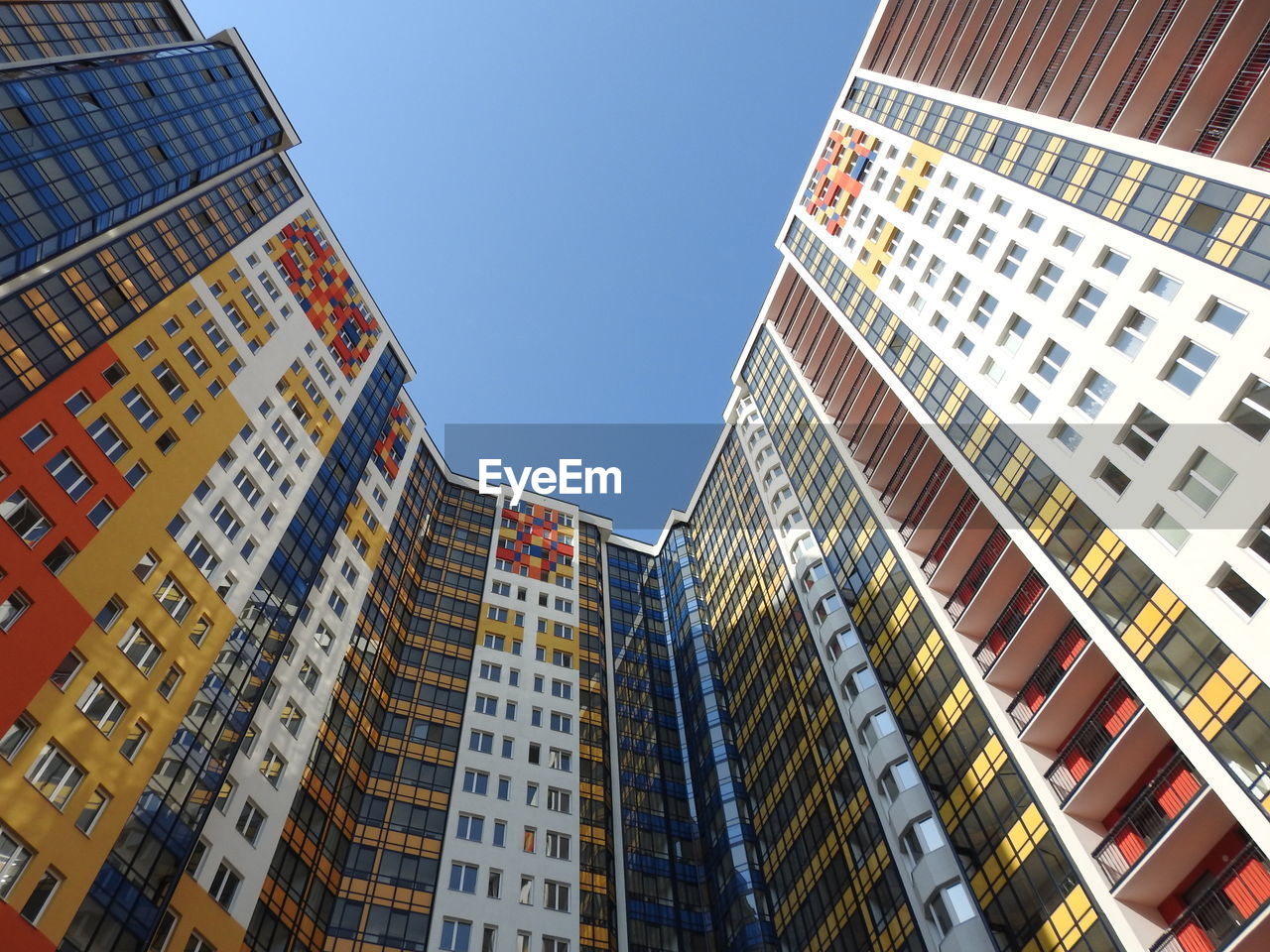 Low angle view of modern buildings against sky