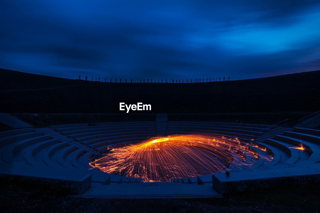 Wire wool against sky at amphitheatre during night