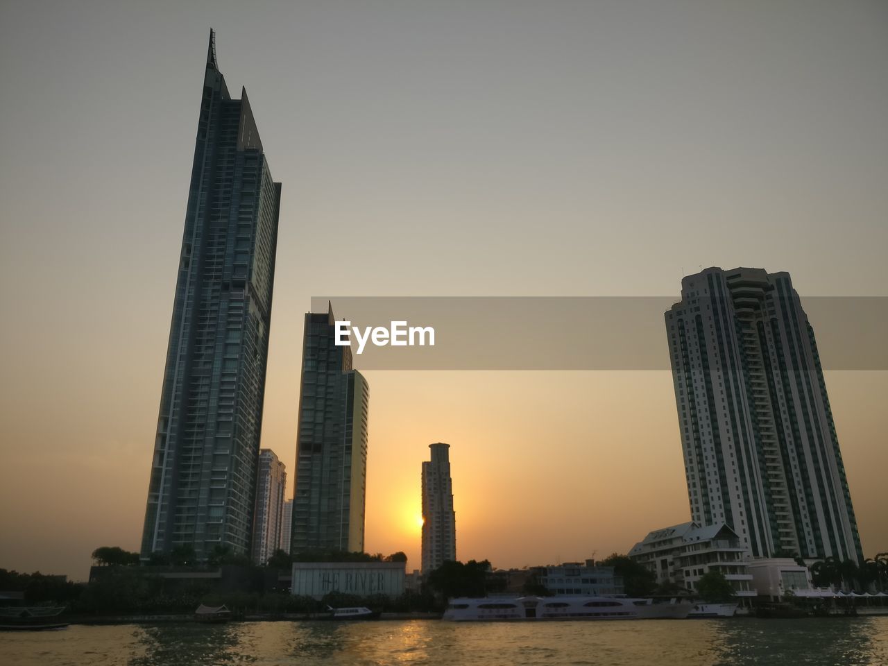 VIEW OF SKYSCRAPERS AT SUNSET