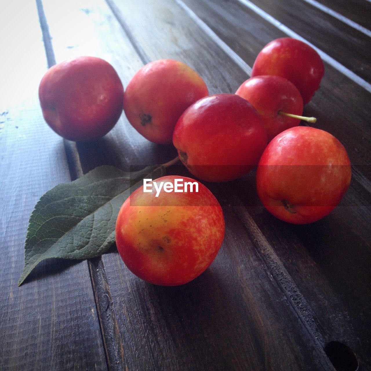 High angle view of red apples on table