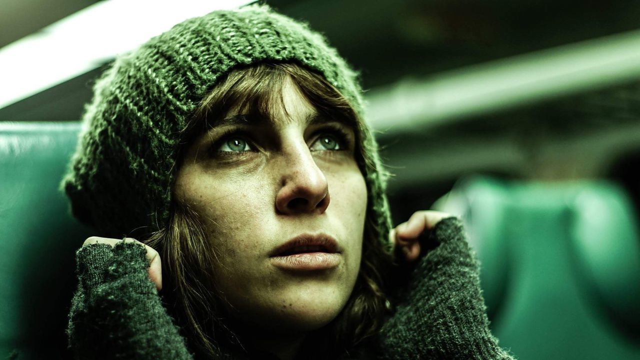 Close-up of young woman traveling in train