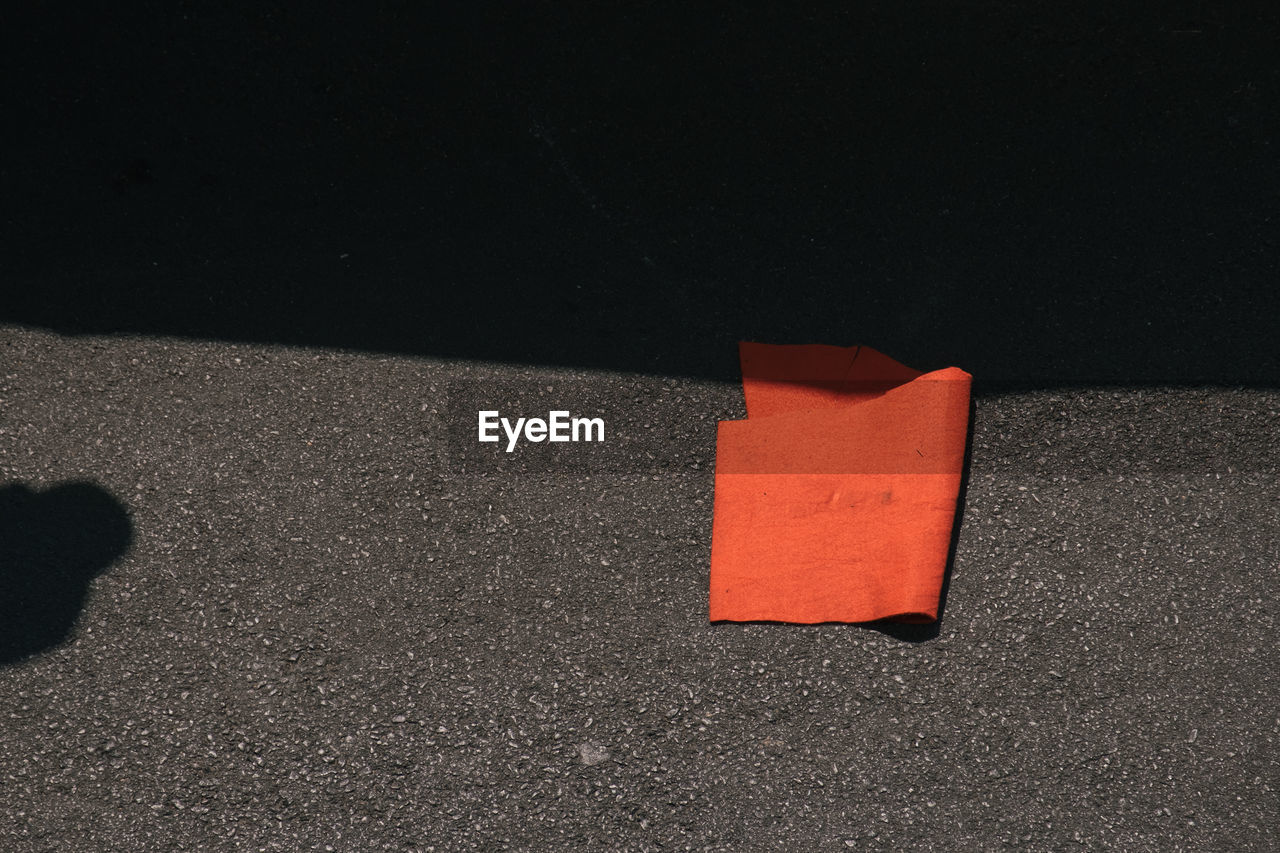 High angle view of red textile on street