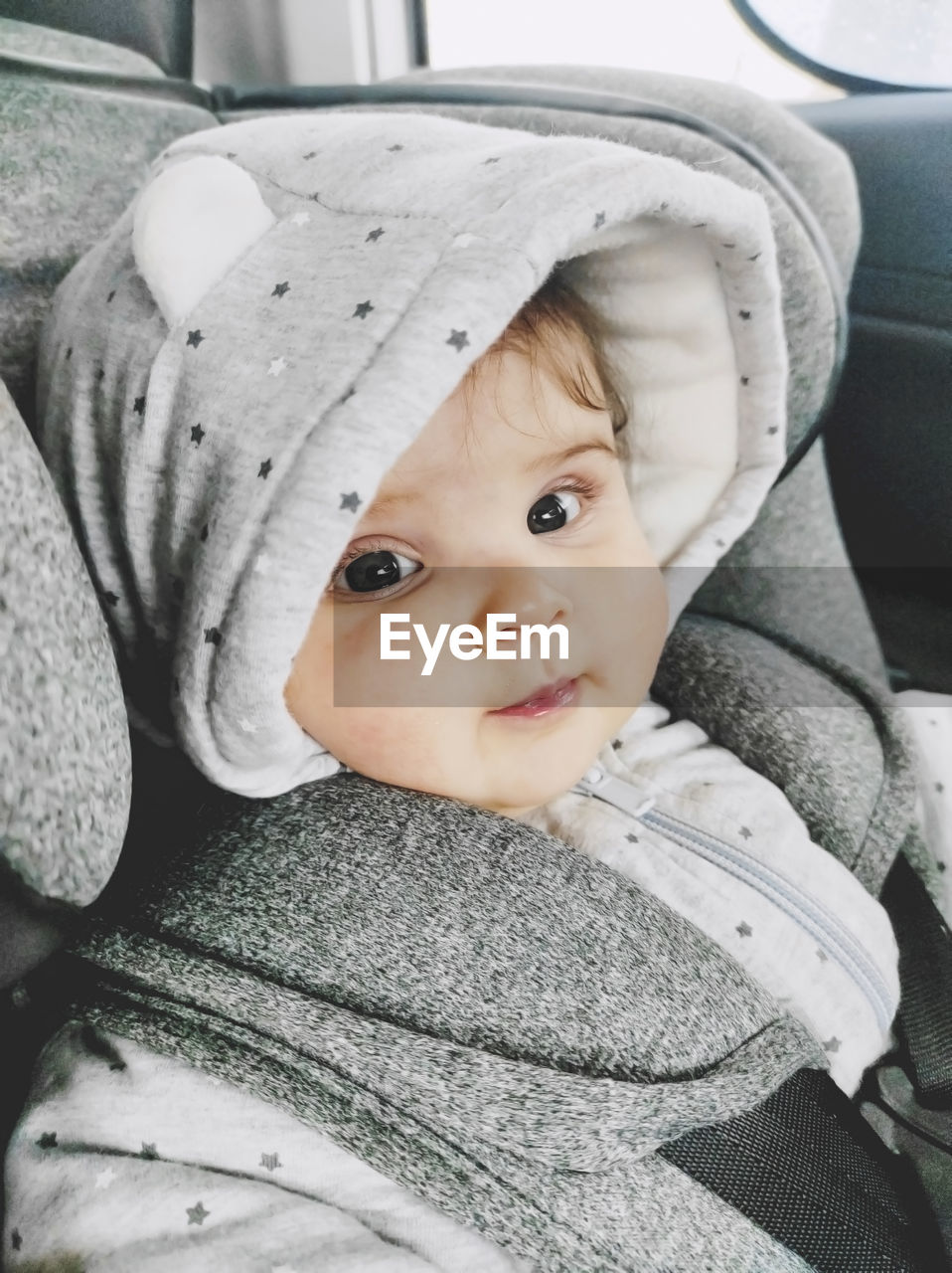 Portrait of baby girl in car