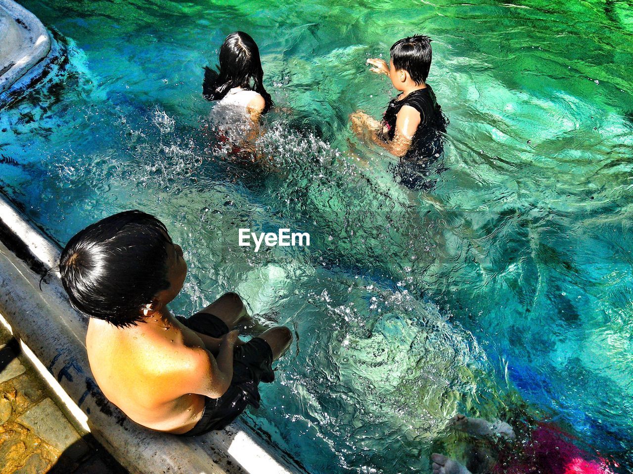 High angle view of children swimming