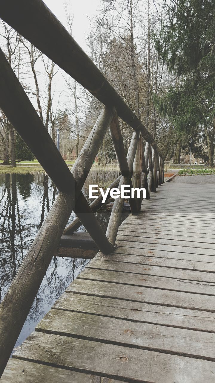 Boardwalk by pond at park