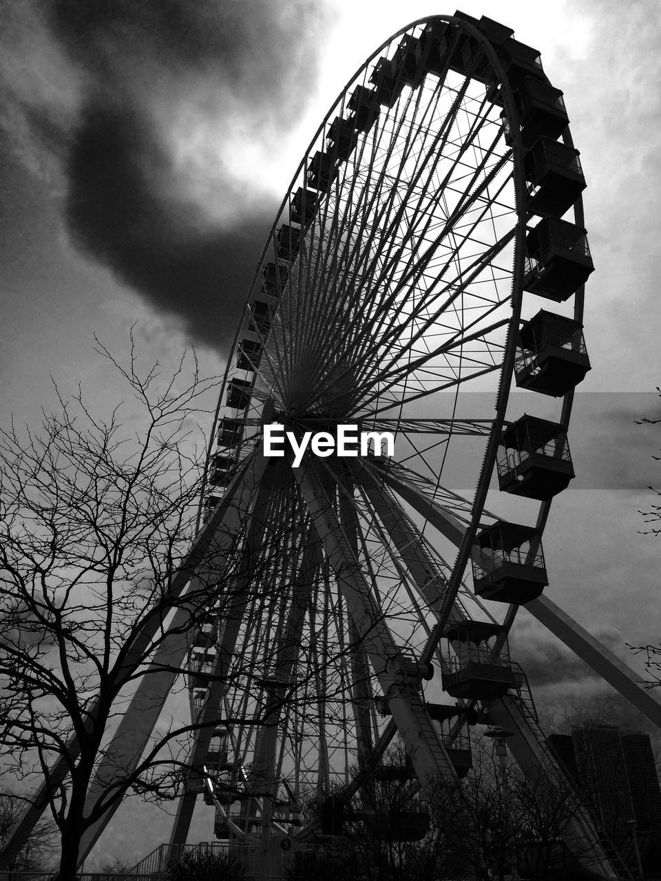 LOW ANGLE VIEW OF FERRIS WHEEL AGAINST SKY