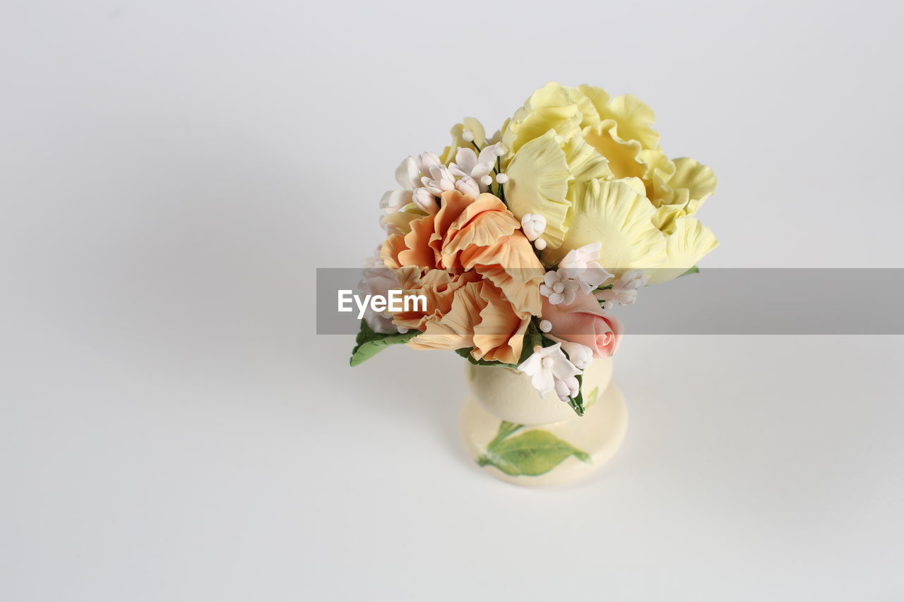 Close-up of bouquet against gray background