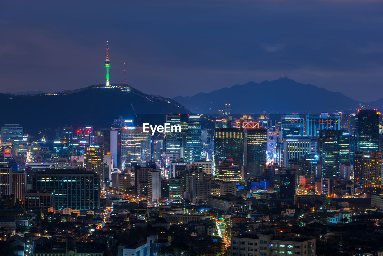 Illuminated buildings in city at night