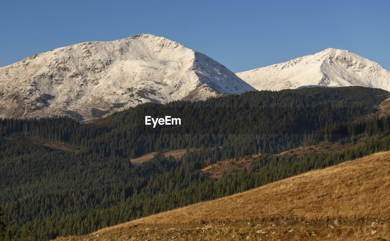 Scenic view of mountains against clear sky