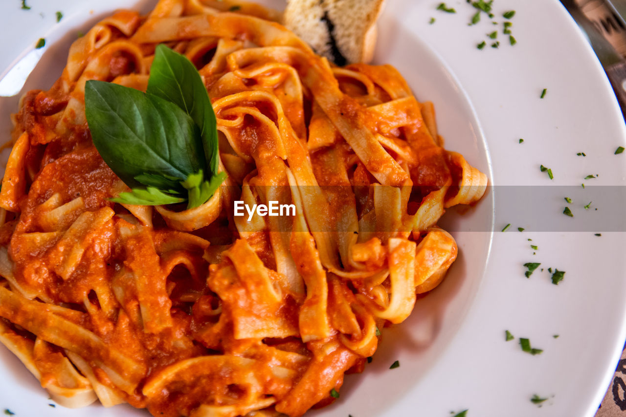 Close-up of red sauce pasta food served in plate