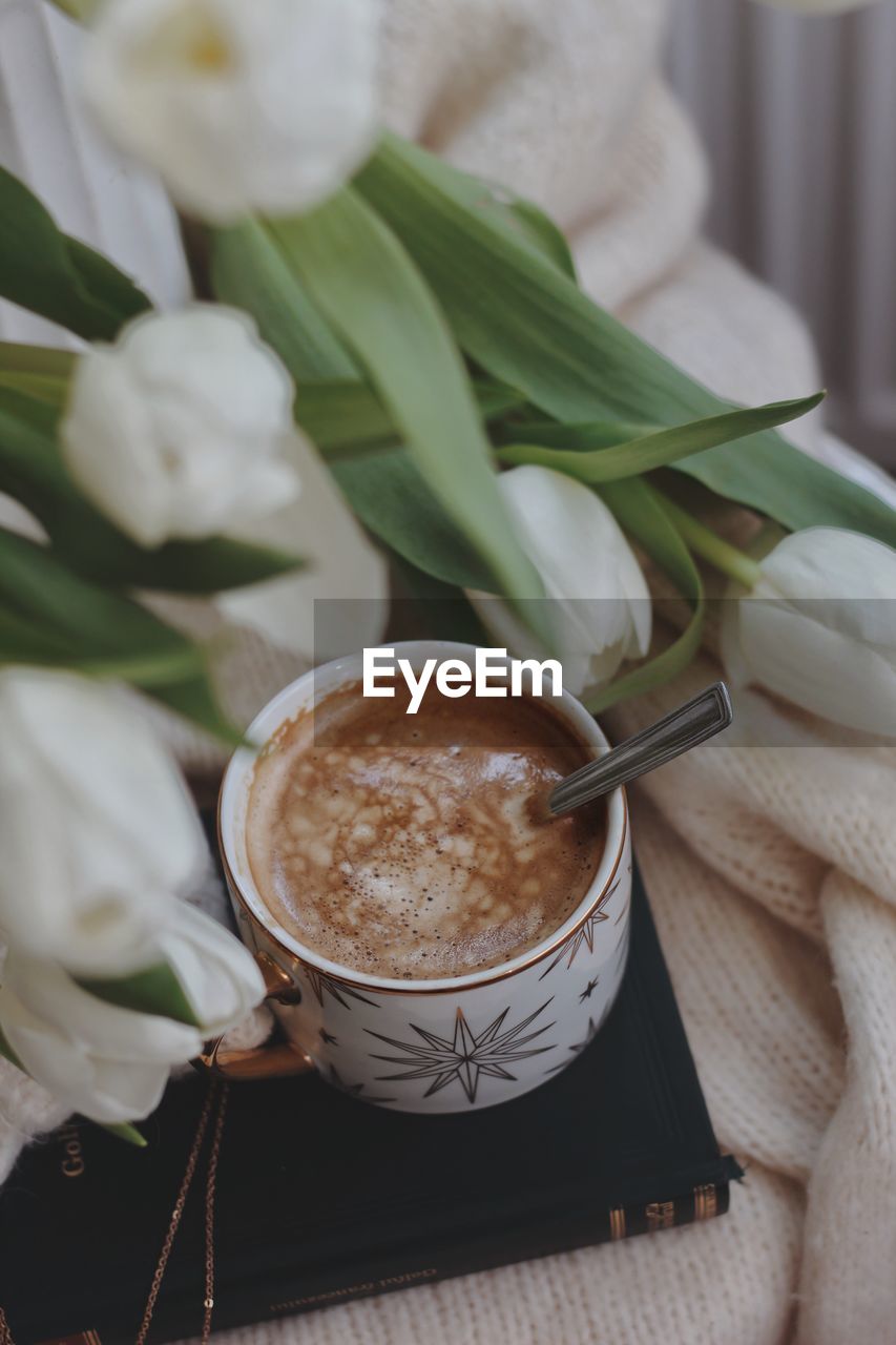 high angle view of coffee cup on table