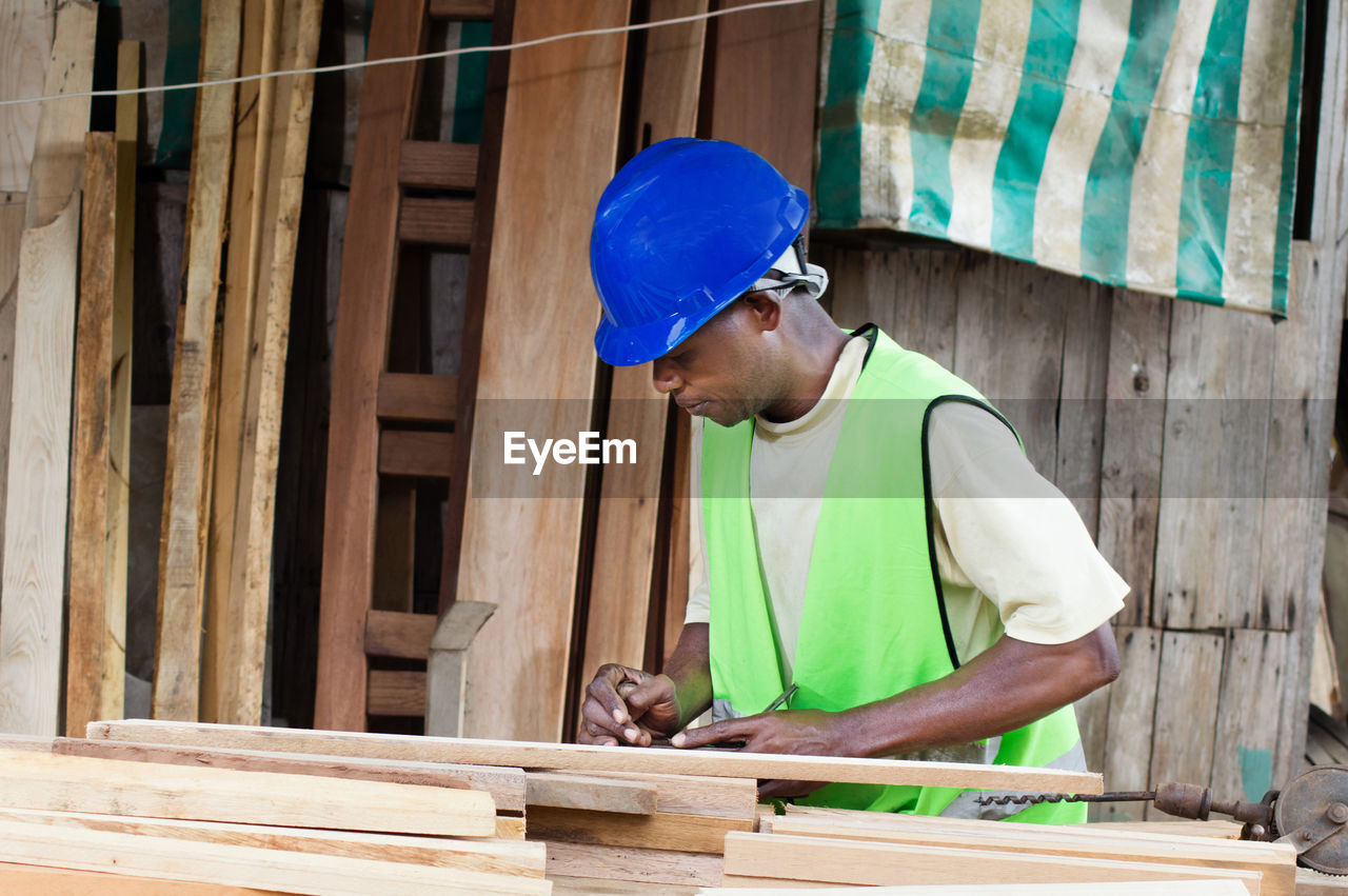 The carpenter planed wood before making furniture.