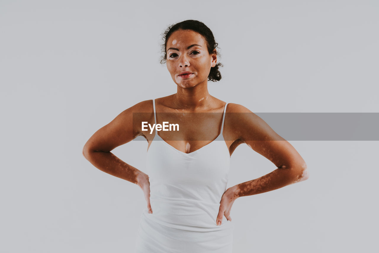 Portrait of woman against white background