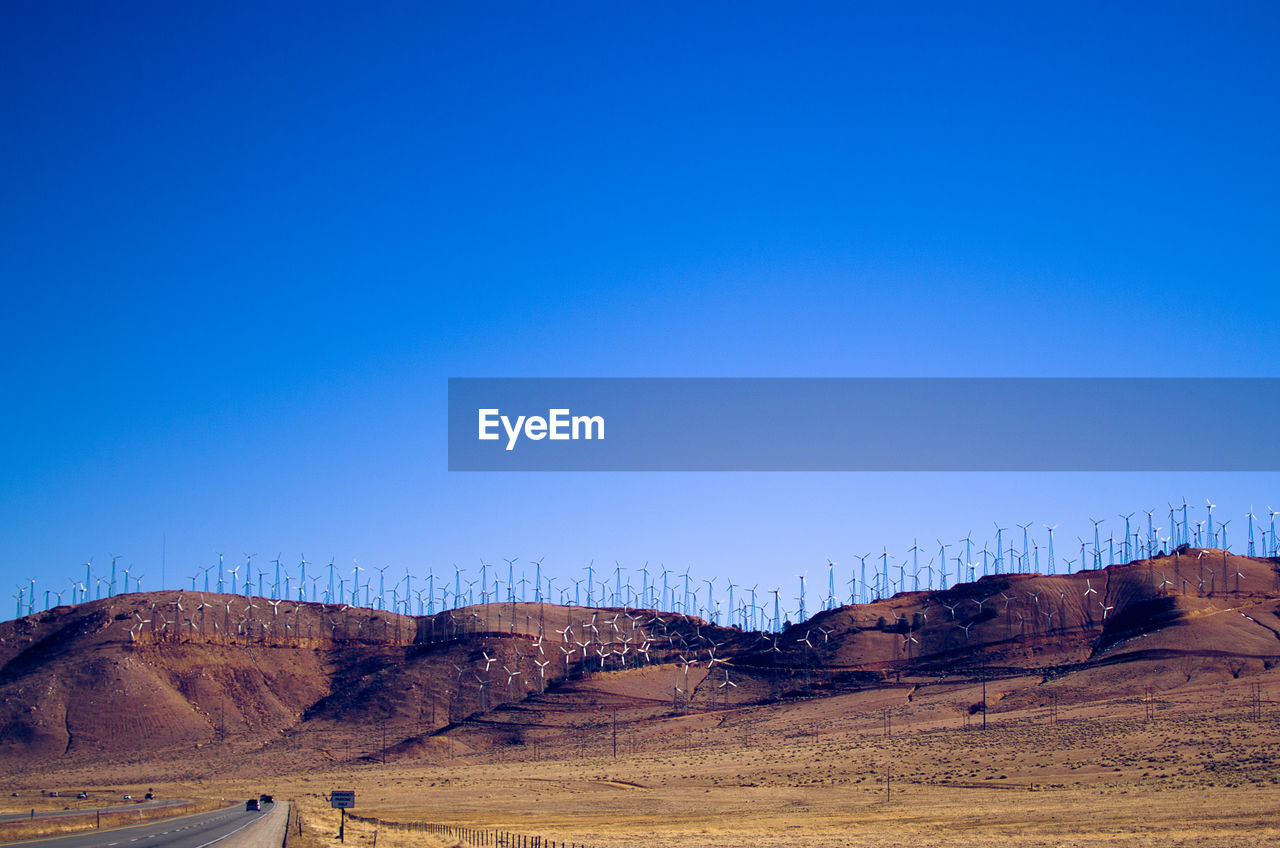 SCENIC VIEW OF LANDSCAPE AGAINST BLUE SKY