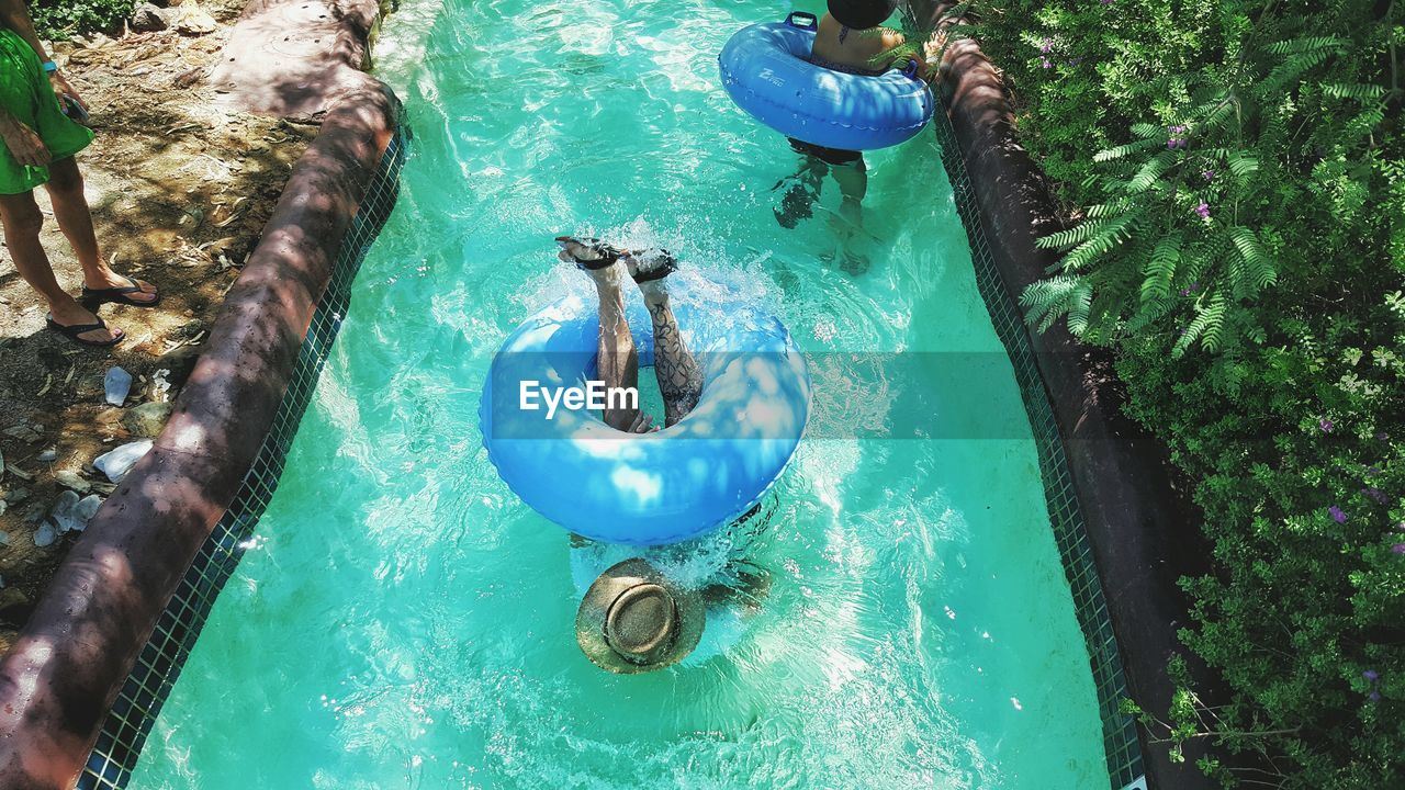 HIGH ANGLE VIEW OF WATER ON BLUE SURFACE