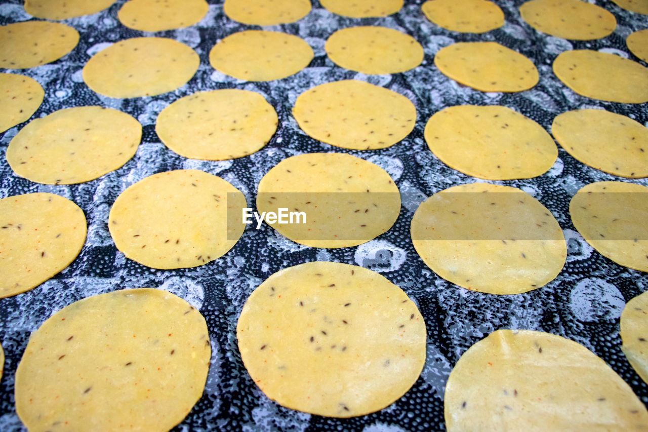 Khichiya papdi papad rice flour crackers or papadom drying, chawal ke papad