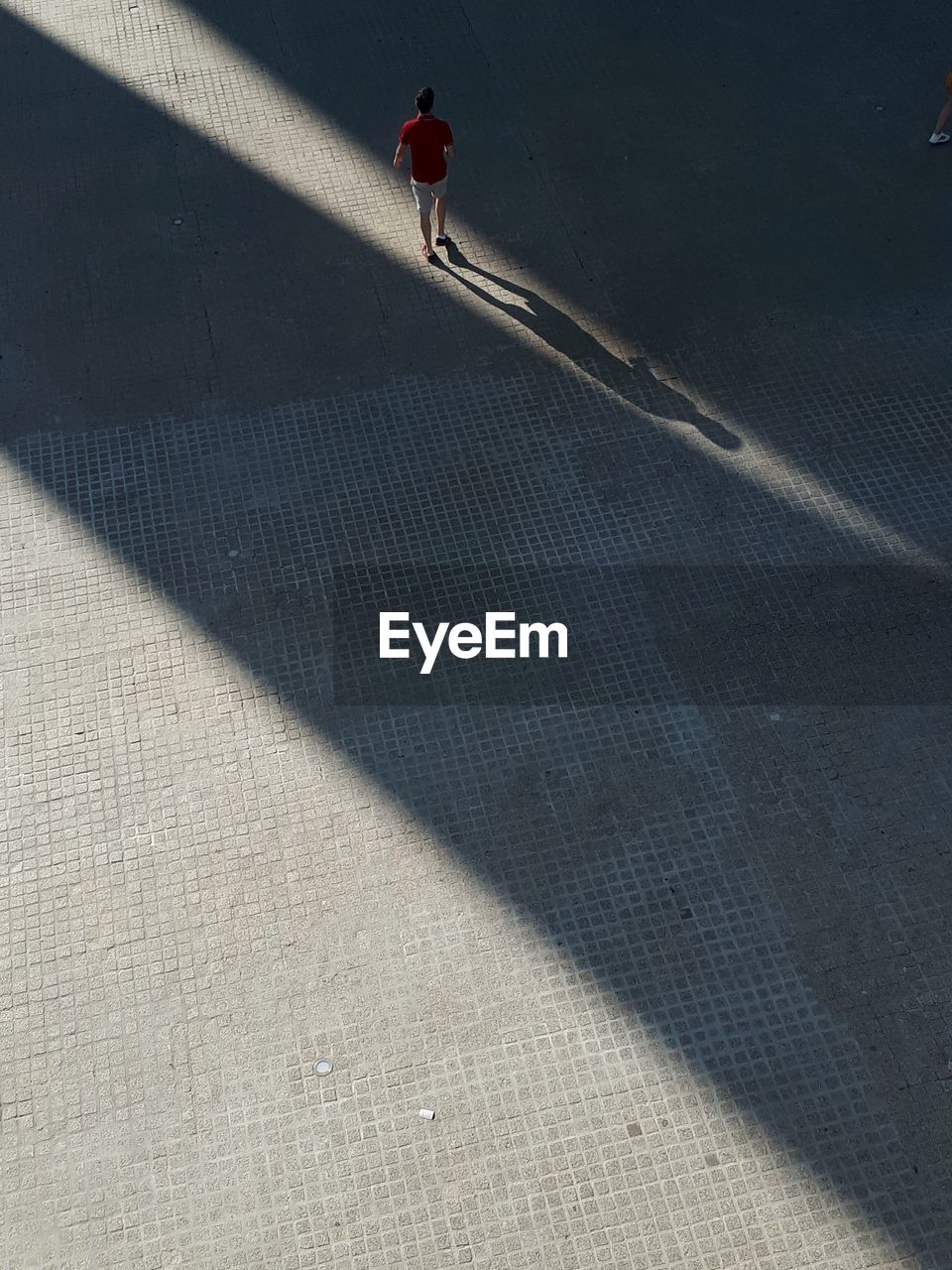 High angle view of person walking on street