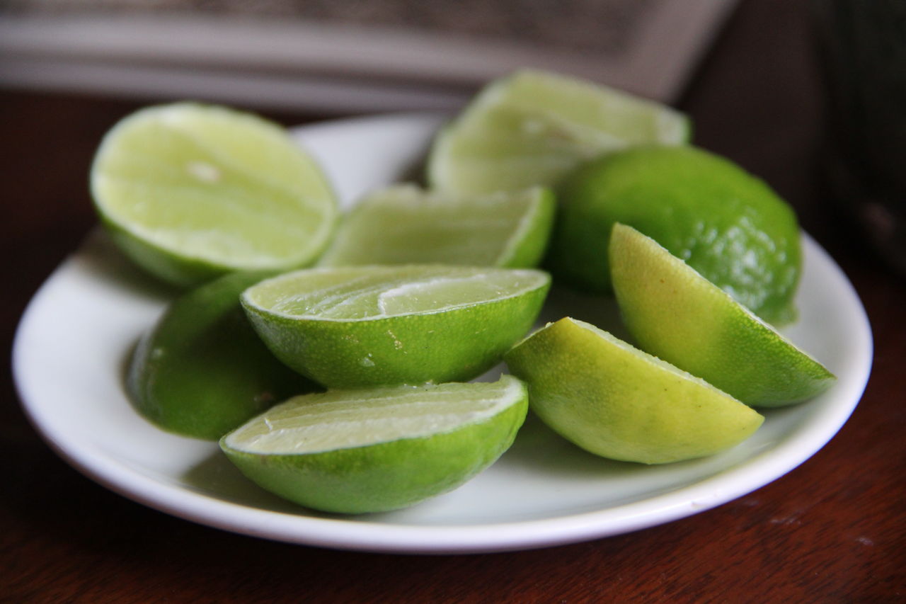 Close-up of fruits in plate on table