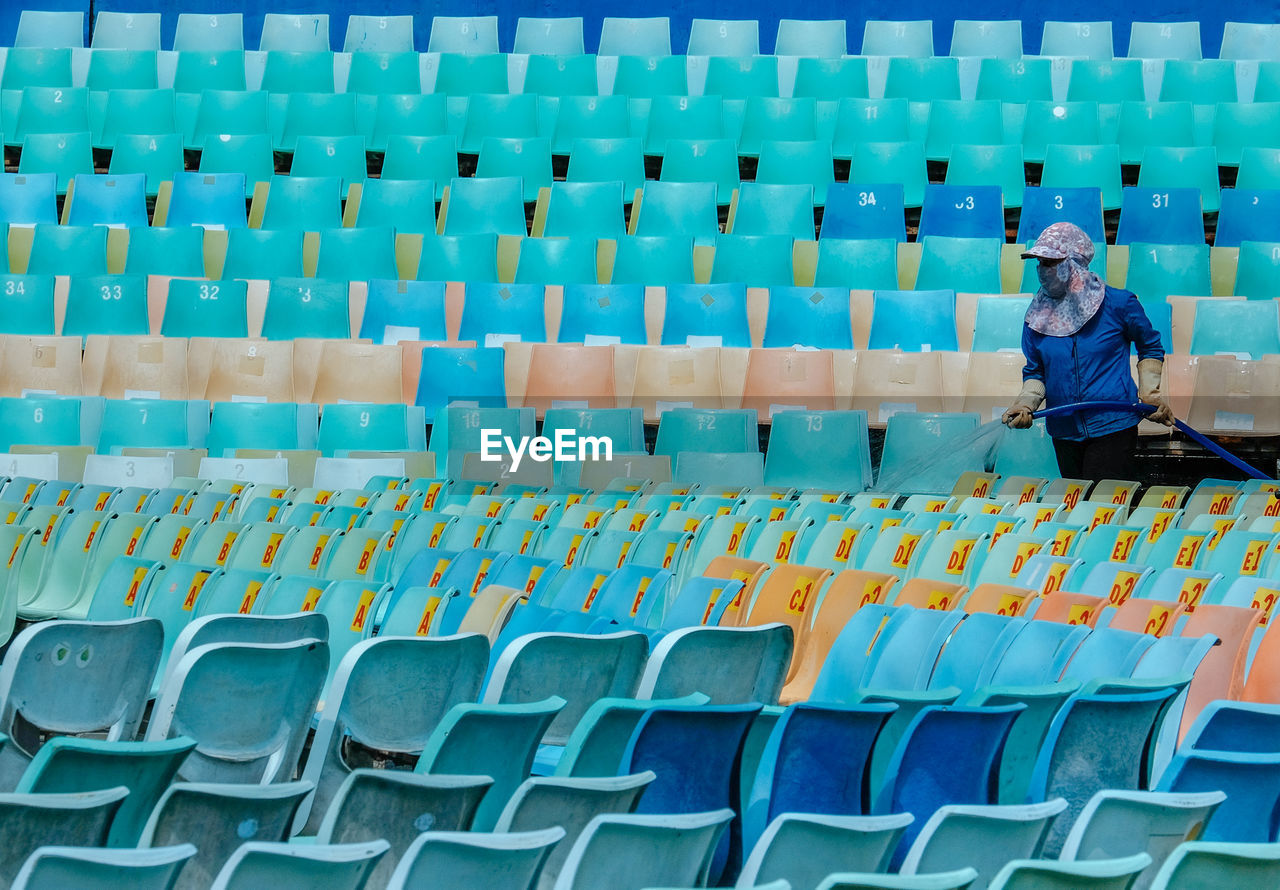 High angle view of man sitting on chair