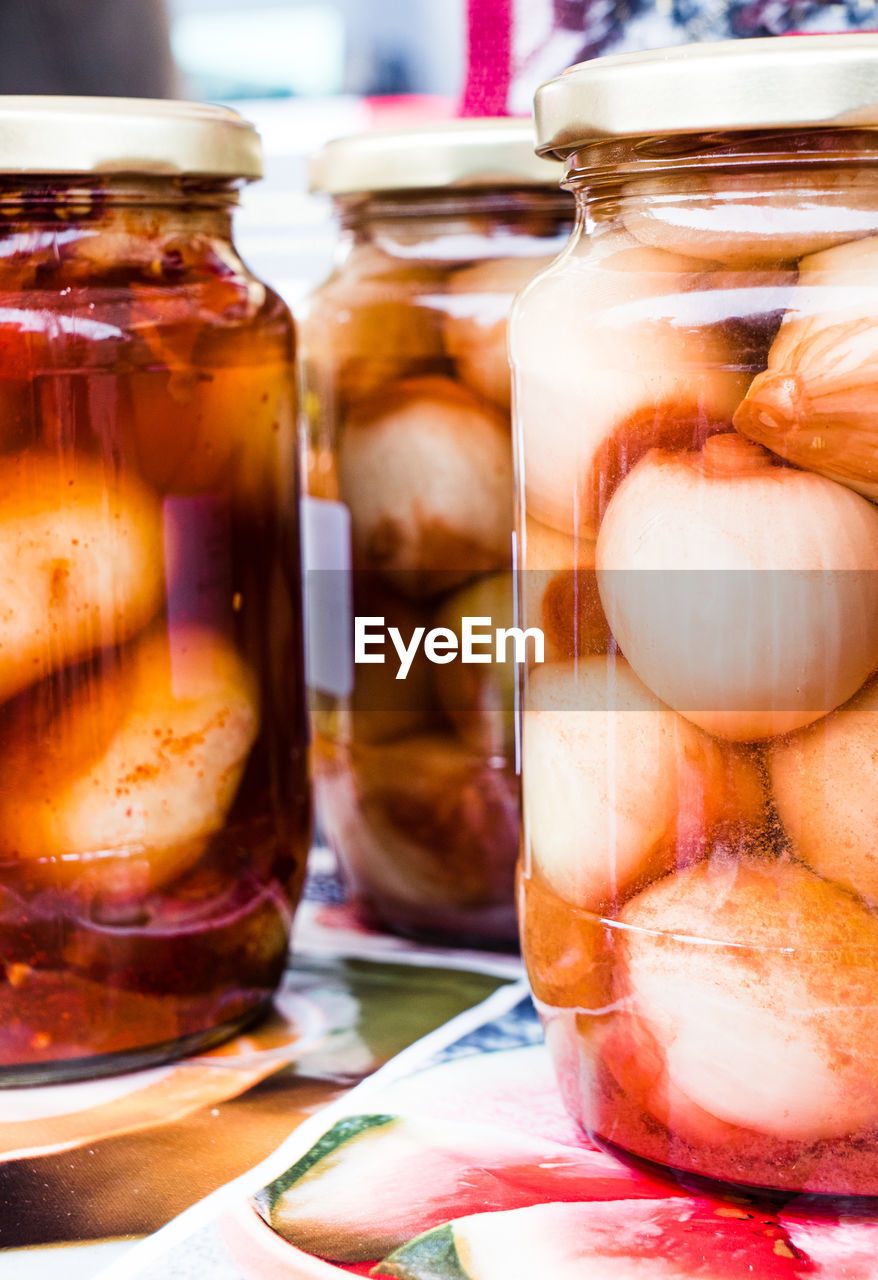 CLOSE-UP OF DRINK IN JAR ON TABLE