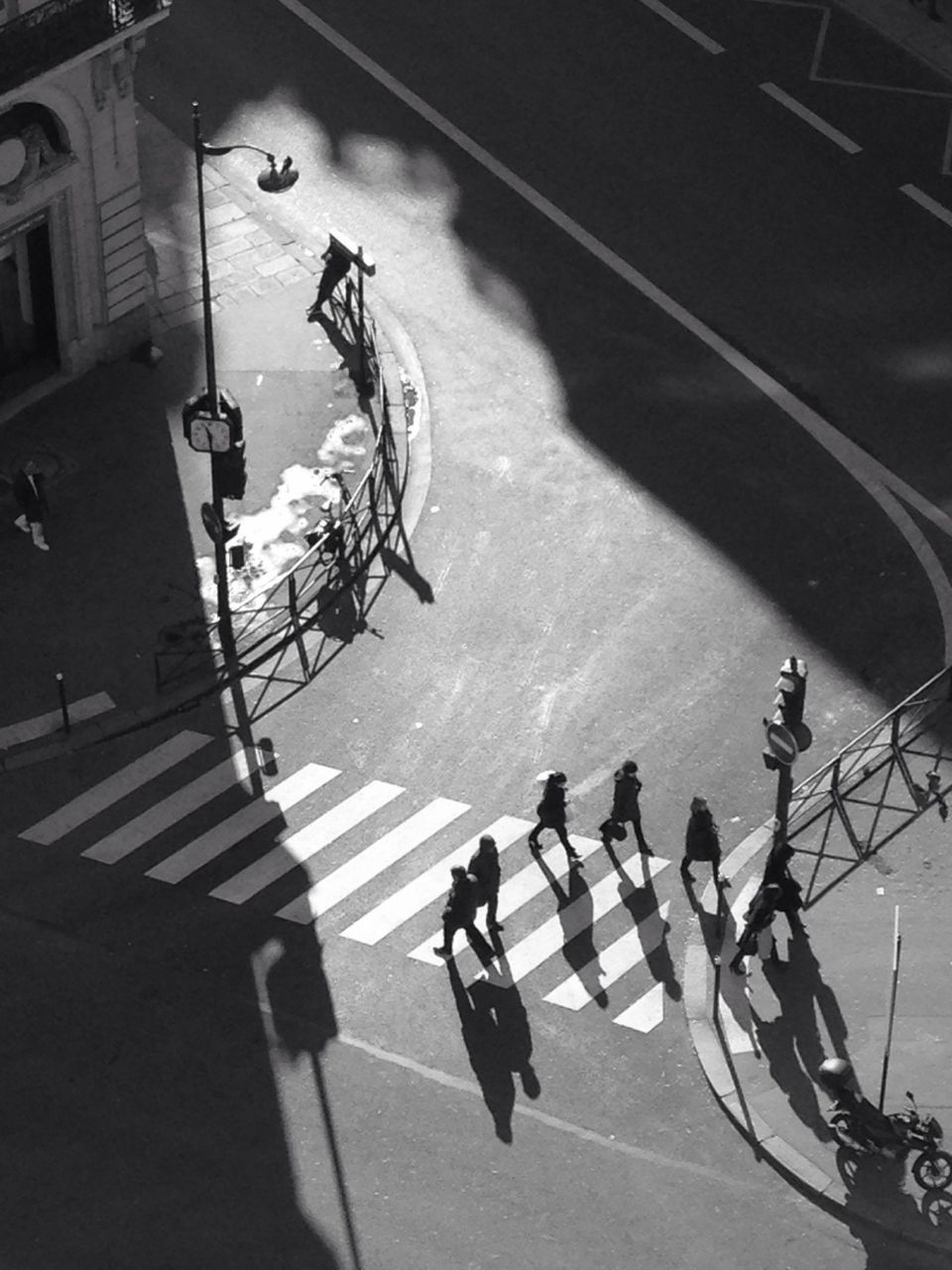 High angle view of people crossing street