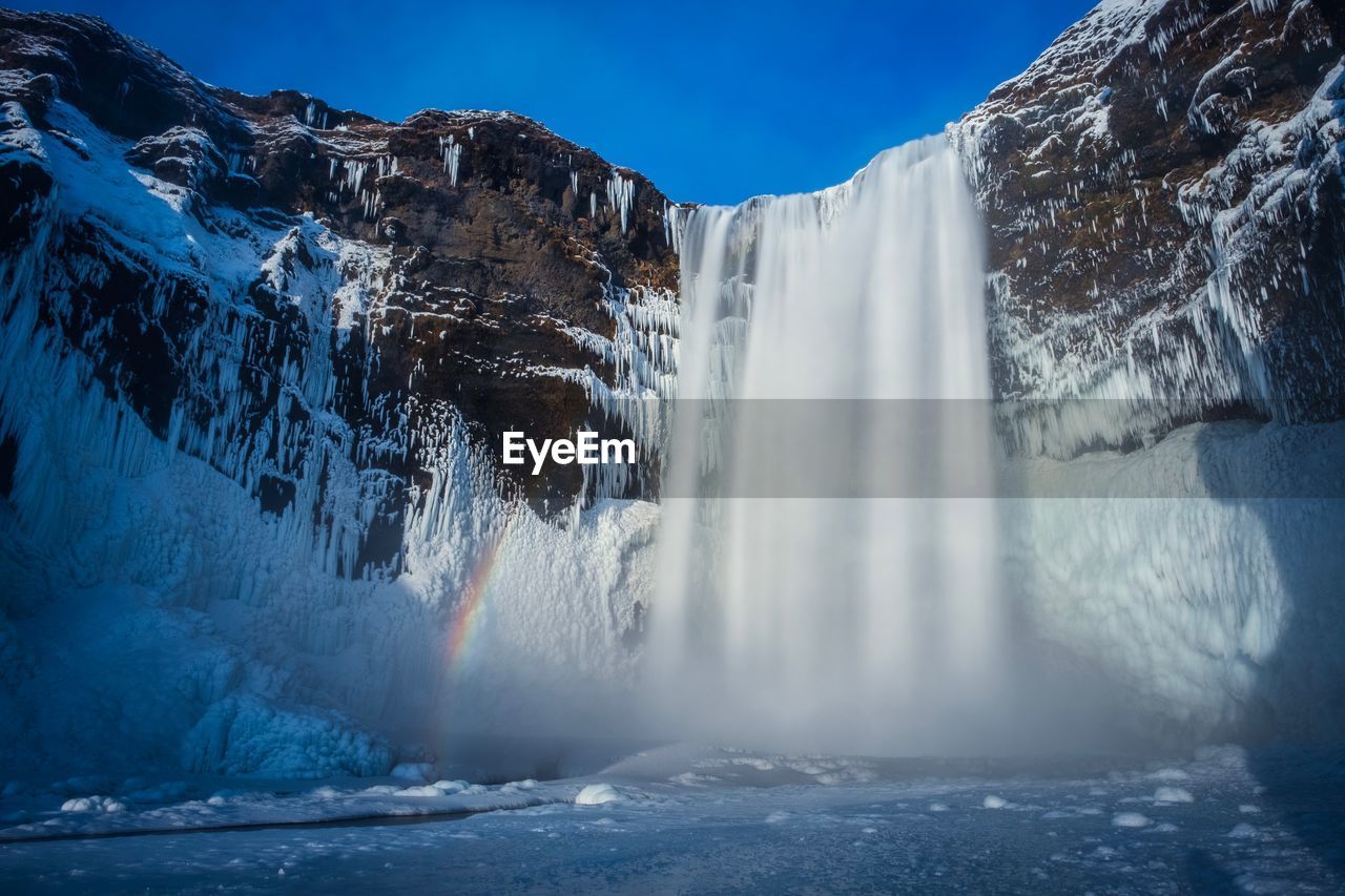 Scenic view of waterfall during winter