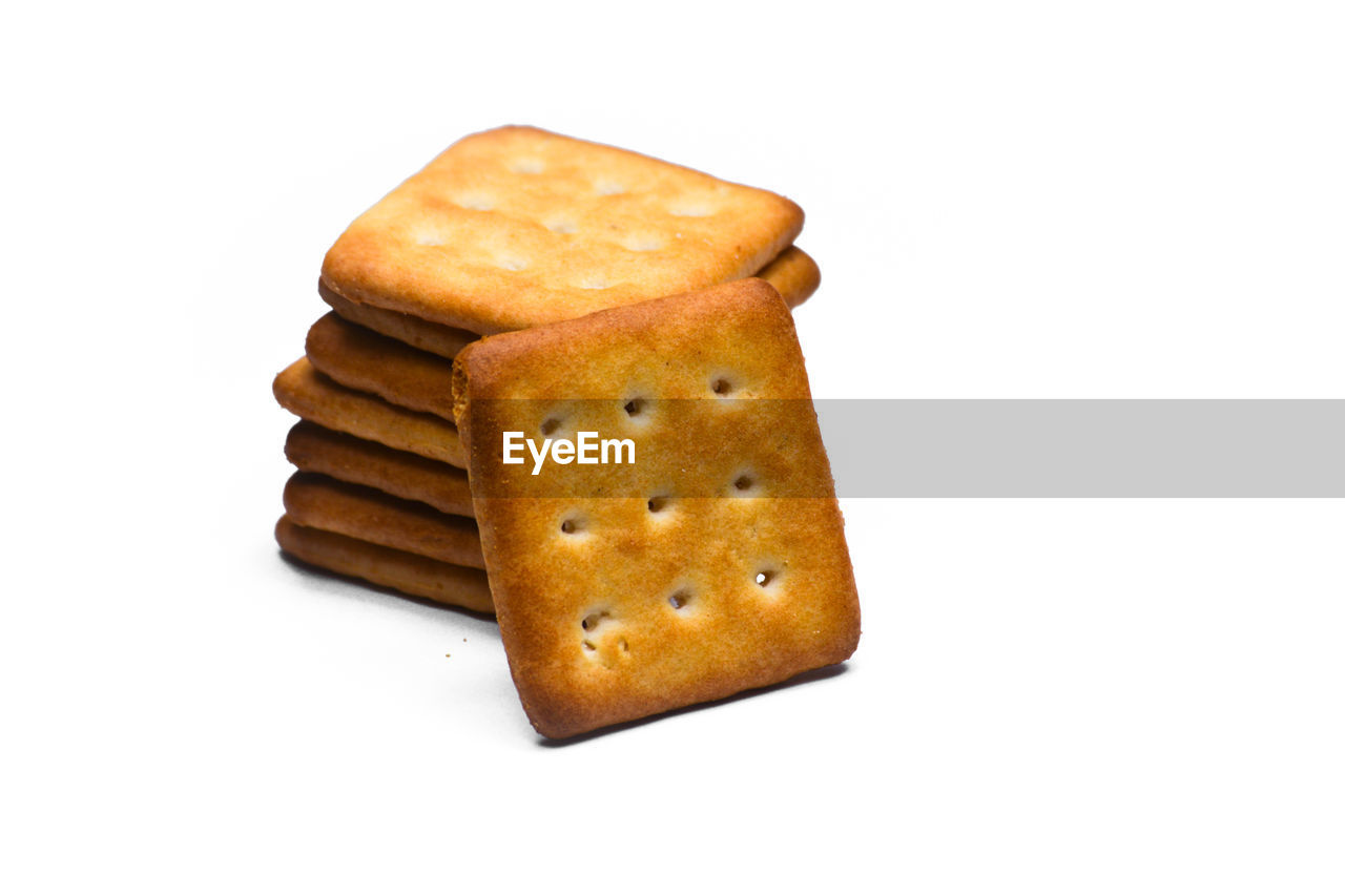 CLOSE-UP OF BREAD ON WHITE BACKGROUND