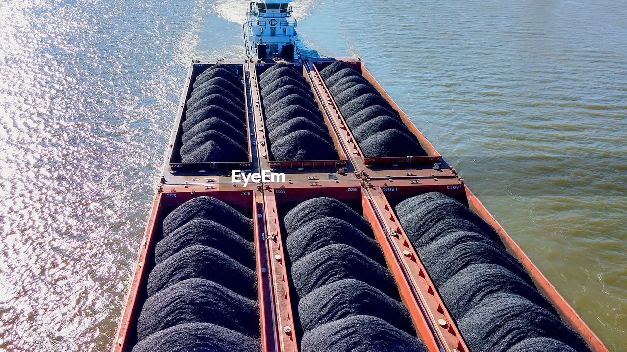 Tugboat pulling barge with coal on ohio river